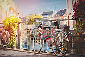Bike near railing on city street of Strasburg