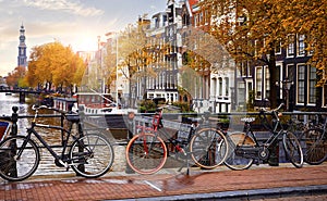 Bike over canal Amsterdam city autumn yellow leaf fall