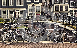 Bike over canal Amsterdam city. Picturesque town landscape in Netherlands.
