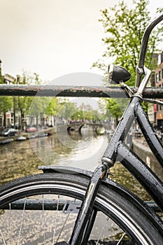 Bike over canal in Amsterdam, The Netherlands