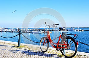 Bike parked along the port of Algarve