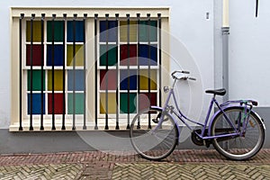 Bike parked on street in Amsterdam, Netherlands