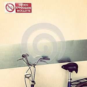 Bike parked under sign