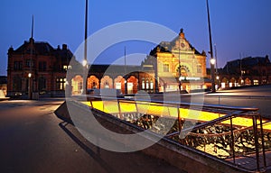 Bike parking by train station at night