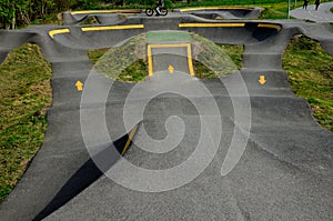 Bike path in the car park Pumping moving up and down is used instead of pedaling and bouncing to move bicycles, scooters, skateb