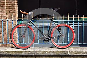 Bike protected by multiple padlocks against theft