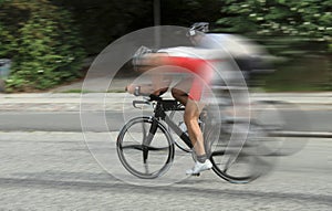 Bike race cyclists at high speed on road with dynamic motion blur