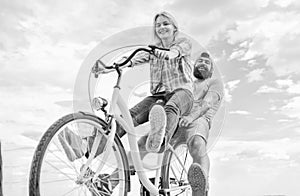Bike rental or bike hire for short periods of time. Couple with bicycle romantic date sky background. Couple in love