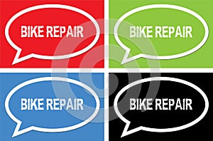 BIKE REPAIR text, on ellipse speech bubble sign.