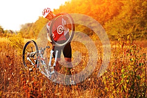 Bike repair. Young man repairing mountain bike