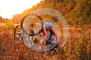 Bike repair. Young man repairing mountain bike