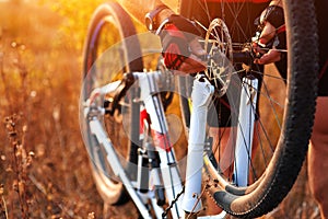 Bike repair. Young man repairing mountain bike