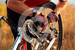 Bike repair. Young man repairing mountain bike