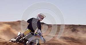 Bike, sand and speed with man off road for action, competition or performance on dirt track. Motorcycle, sports and