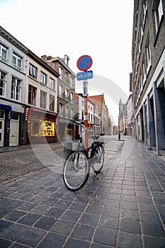 Bike, shopping street in Bruges without people