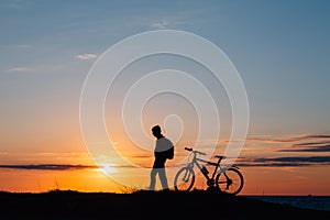 The bike silhouette in the mountains.