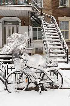 Bike and stairs covered with fresh snow