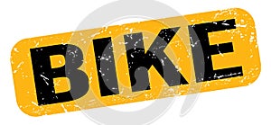 BIKE text on yellow-black grungy stamp sign