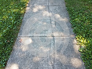 Bike tire tracks in grey cement