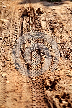 Bike tire tracks on muddy trail royalty. Tire tracks on wet muddy road, abstract background, texture material.