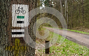 Bike trail sign, tourist hiking trail - bike path in Poland Nature Reserve forest