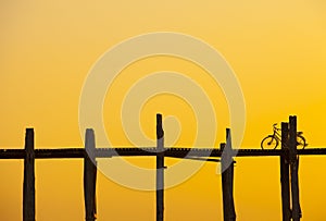 Bike on U Bein Bridge at sunset