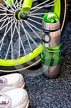 Bike weel, bottle and sport shoes