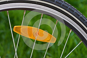 Bike wheel cut out with orange reflector