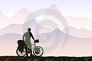 Bikepacking in mountain landscape. Traveling man standing with touring bicycle with bags silhouette