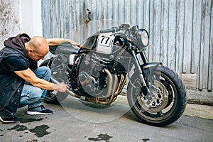 Biker checking with a motorcycle