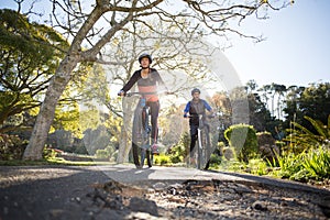 Biker couple cycling on the countryside road