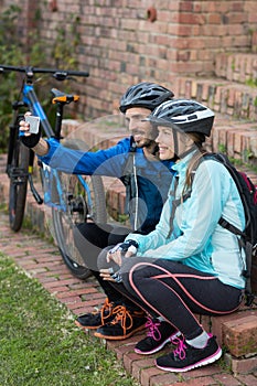 Biker couple taking selfie from mobile phone