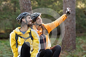 Biker couple taking selfie from mobile phone