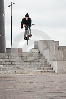 Biker doing bar spin trick