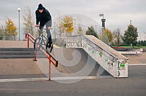 Biker doing crank slide grind trick