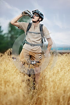 Biker drinking isotonic drink