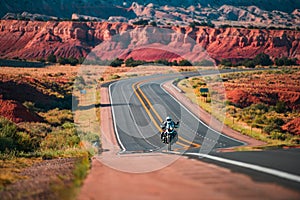 Biker driving on the Highway on legendary Route 66, Arizona. Panoramic picture of a scenic road, USA.