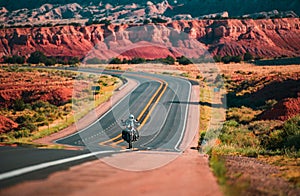 Biker driving on the Highway on legendary Route 66, Arizona. Panoramic picture of a scenic road, USA.