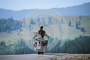 Biker driving his cruiser motorcycle on road