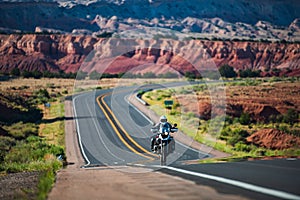 Biker driving on motorbike, Route 66, Arizona. Panoramic picture of a scenic road, USA. Natural american landscape with