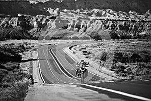 Biker driving on motorbike, Route 66, Arizona. Panoramic picture of a scenic road, USA. Natural american landscape with