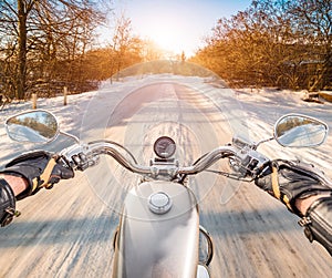 Biker First-person view. Winter slippery road