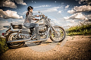 Biker girl and bike Harley Sportster