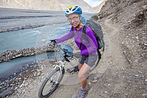 Biker-girl in Himalaya mountains