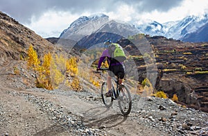 Biker-girl in Himalaya mountains, Anapurna region