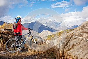 Biker-girl in Himalaya mountains