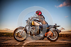 Biker girl on a motorcycle photo