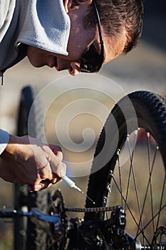 Biker lubricate bicycle chain