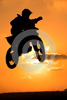 A biker makes a big jump