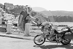 Biker man rock and roll jamp. touristic motorcycle background. Happy to arrive at your destination. Sunny Beach Italy. Travel and photo